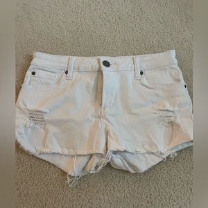 White distressed shorts